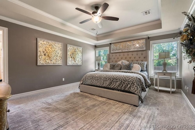 10406 N 86th E Ave, Owasso, OK 74055 - bedroom featuring a tray ceiling, carpet, baseboards, crown molding, and ceiling fan