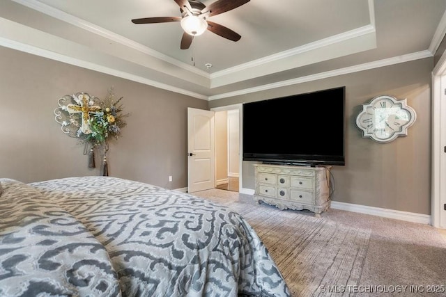 10406 N 86th E Ave, Owasso, OK 74055 - bedroom with a tray ceiling, baseboards, ornamental molding, and a ceiling fan