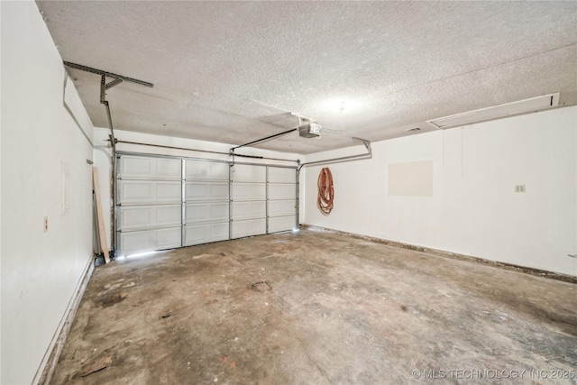 8208 N 122nd E Ave, Owasso, OK 74055 - garage with a garage door opener and baseboards