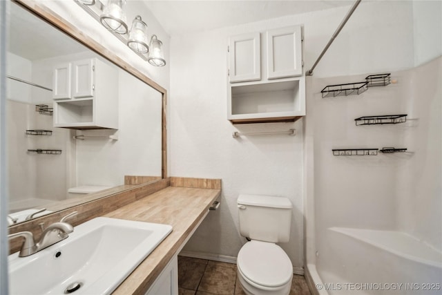 8208 N 122nd E Ave, Owasso, OK 74055 - bathroom featuring vanity, toilet, baseboards, and tile patterned floors