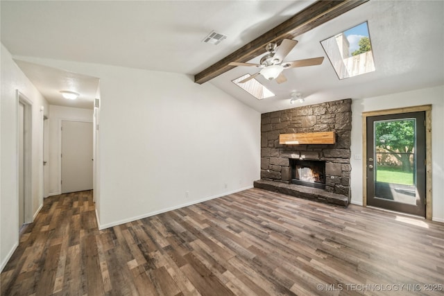 8208 N 122nd E Ave, Owasso, OK 74055 - unfurnished living room featuring a skylight, a ceiling fan, wood finished floors, a fireplace, and baseboards