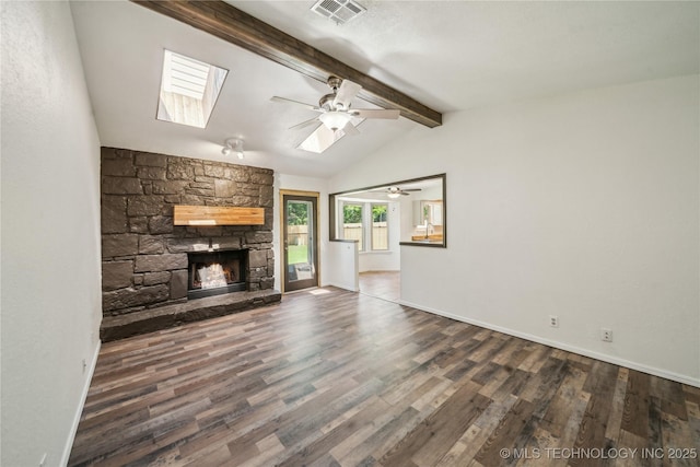 8208 N 122nd E Ave, Owasso, OK 74055 - unfurnished living room with ceiling fan, a stone fireplace, wood finished floors, a skylight, and baseboards