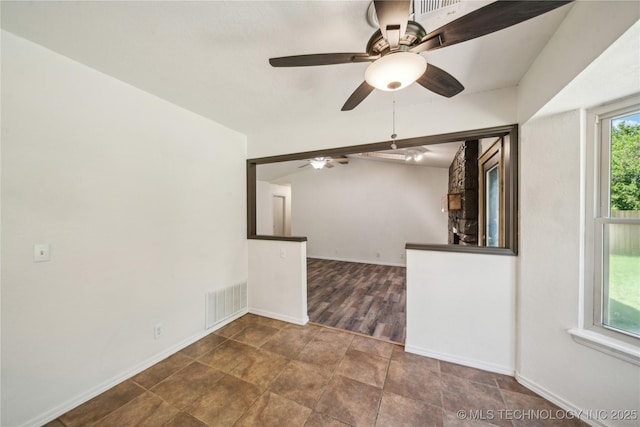 8208 N 122nd E Ave, Owasso, OK 74055 - spare room featuring a ceiling fan and baseboards