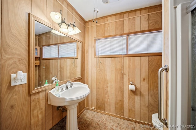 4921 E 26th St, Tulsa, OK 74114 - bathroom with wood walls and toilet