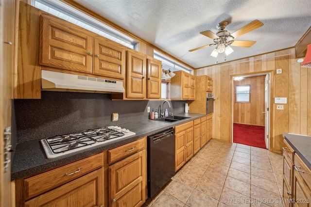 4921 E 26th St, Tulsa, OK 74114 - kitchen with black dishwasher, a sink, under cabinet range hood, white gas stovetop, and oven