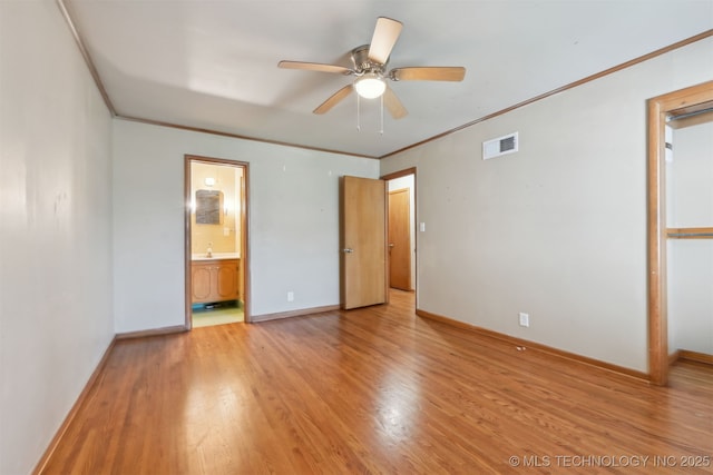 1604 E 55th Pl, Tulsa, OK 74105 - unfurnished bedroom featuring light wood finished floors, ornamental molding, baseboards, connected bathroom, and a ceiling fan