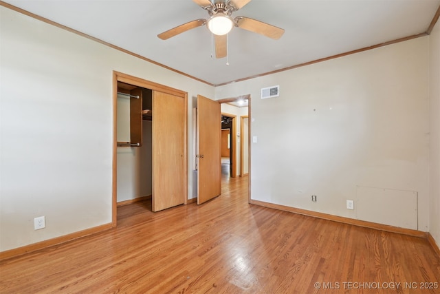 1604 E 55th Pl, Tulsa, OK 74105 - unfurnished bedroom featuring baseboards, ornamental molding, light wood-style flooring, a closet, and a ceiling fan