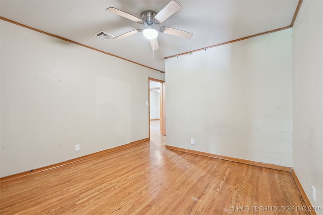 1604 E 55th Pl, Tulsa, OK 74105 - unfurnished room featuring wood finished floors, ceiling fan, baseboards, and ornamental molding
