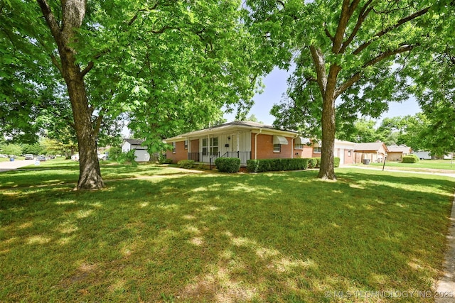 1604 E 55th Pl, Tulsa, OK 74105 - single story home with brick siding, a front lawn, and covered porch