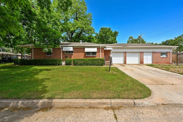 1604 E 55th Pl, Tulsa, OK 74105 - ranch-style house featuring an attached garage, brick siding, and driveway