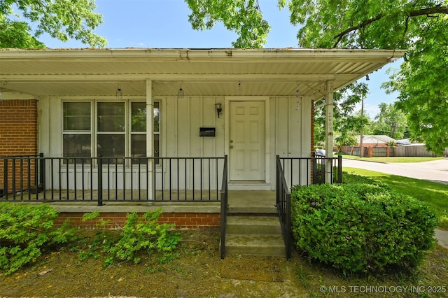 1604 E 55th Pl, Tulsa, OK 74105 - entrance to property featuring covered porch and board and batten siding