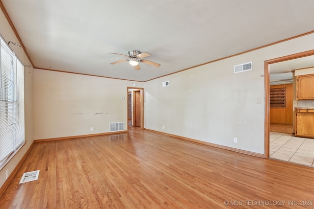 1604 E 55th Pl, Tulsa, OK 74105 - spare room with ceiling fan, light wood-style flooring, baseboards, and ornamental molding