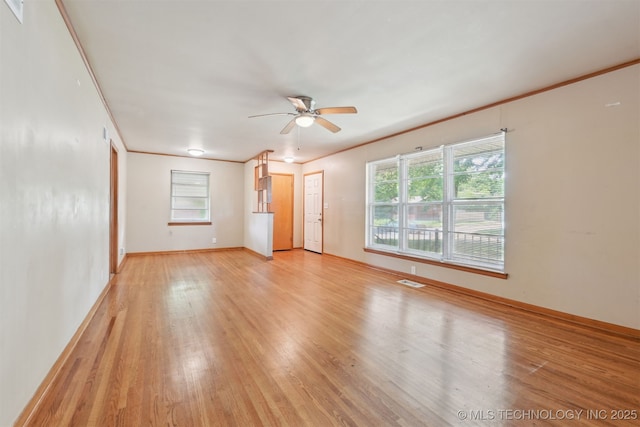 1604 E 55th Pl, Tulsa, OK 74105 - unfurnished room featuring light wood-style flooring, a ceiling fan, baseboards, and crown molding