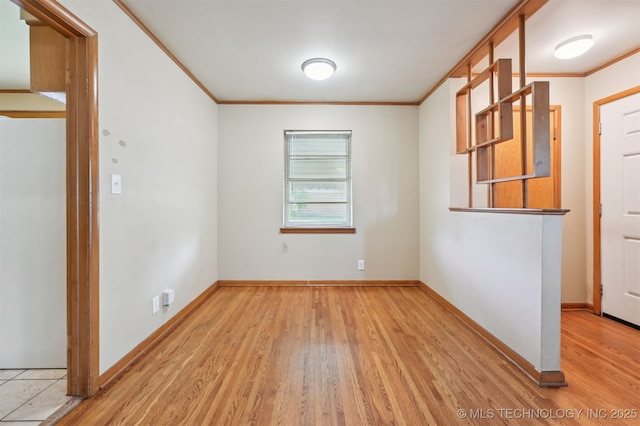 1604 E 55th Pl, Tulsa, OK 74105 - unfurnished room featuring crown molding, wood finished floors, and baseboards