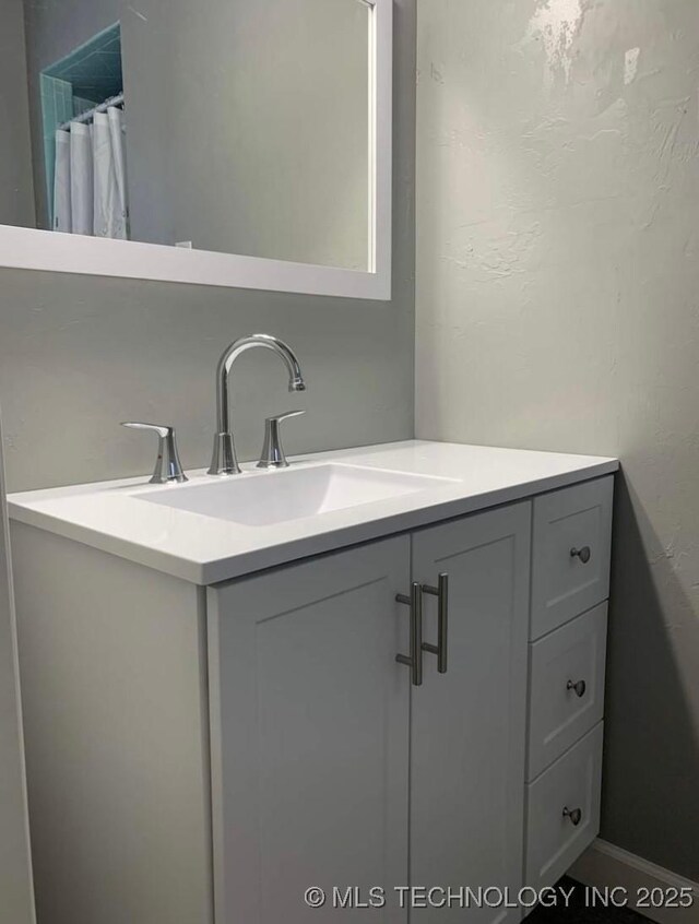 1011 E 11th St, Cushing, OK 74023 - bathroom with vanity and a shower with shower curtain