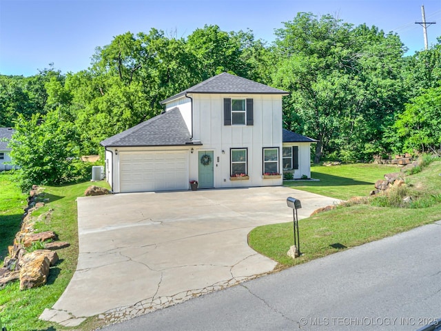 228 W Ohio Ave, Kiefer, OK 74041 - traditional-style house featuring a shingled roof, board and batten siding, driveway, an attached garage, and a front lawn
