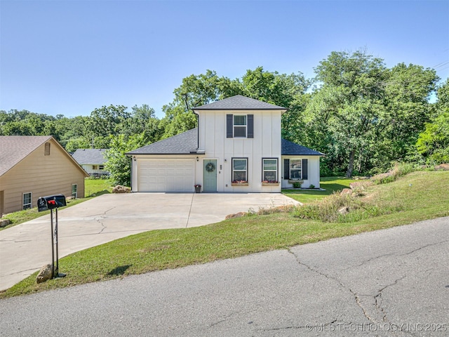 228 W Ohio Ave, Kiefer, OK 74041 - traditional-style home featuring board and batten siding, driveway, a garage, roof with shingles, and a front yard