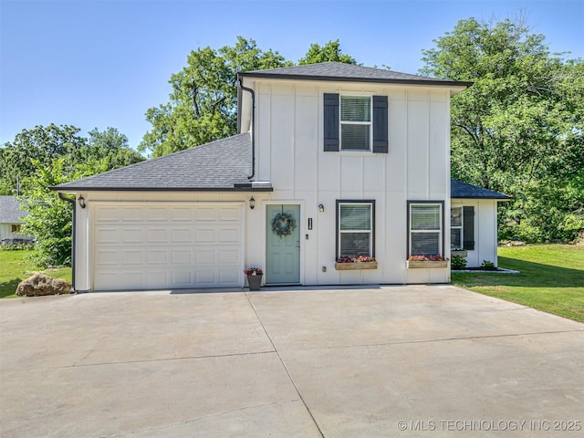 228 W Ohio Ave, Kiefer, OK 74041 - view of front facade with board and batten siding, concrete driveway, roof with shingles, and an attached garage