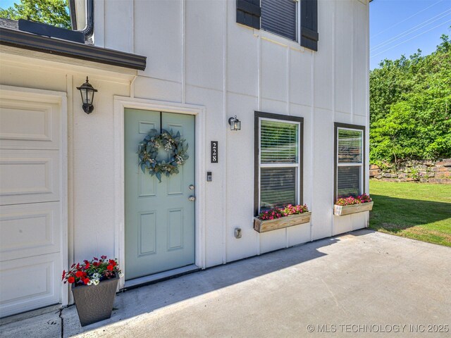 228 W Ohio Ave, Kiefer, OK 74041 - view of exterior entry with board and batten siding
