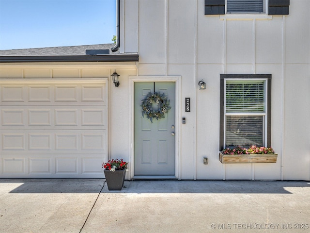 228 W Ohio Ave, Kiefer, OK 74041 - property entrance featuring driveway and board and batten siding