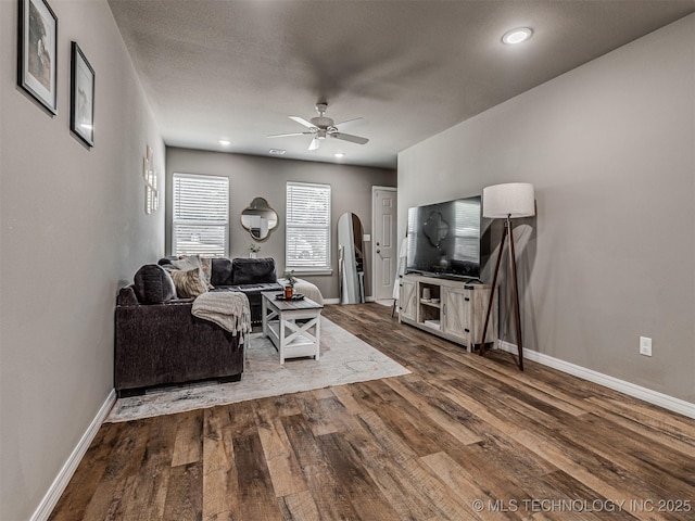 228 W Ohio Ave, Kiefer, OK 74041 - living area featuring arched walkways, wood finished floors, ceiling fan, baseboards, and recessed lighting