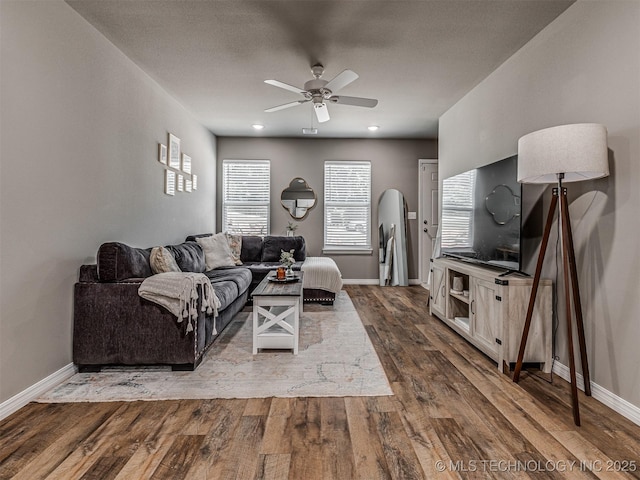 228 W Ohio Ave, Kiefer, OK 74041 - living area featuring a ceiling fan, dark wood-type flooring, baseboards, and healthy amount of natural light