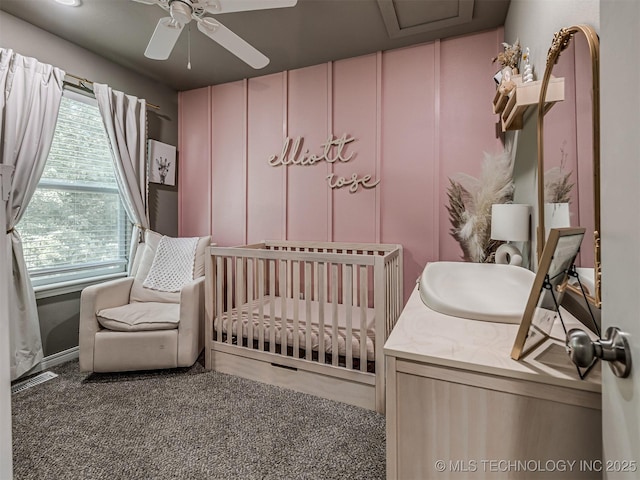 228 W Ohio Ave, Kiefer, OK 74041 - carpeted bedroom with a crib and a ceiling fan