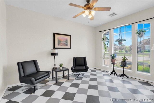 3000 S Tamarack Ave, Broken Arrow, OK 74012 - living area with tile patterned floors, baseboards, and a ceiling fan
