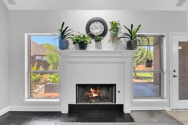 3000 S Tamarack Ave, Broken Arrow, OK 74012 - detailed view of a fireplace with flush hearth and baseboards