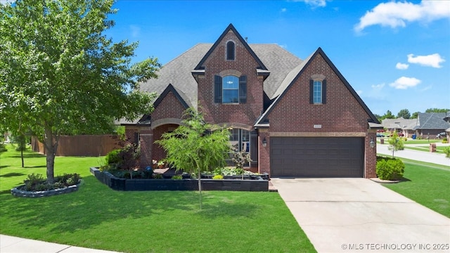 3000 S Tamarack Ave, Broken Arrow, OK 74012 - view of front of house featuring brick siding, driveway, an attached garage, and a shingled roof
