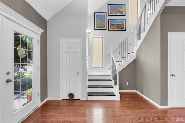 3000 S Tamarack Ave, Broken Arrow, OK 74012 - entryway featuring high vaulted ceiling, wood finished floors, stairway, and baseboards