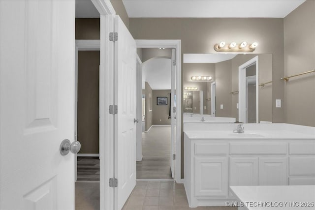 3000 S Tamarack Ave, Broken Arrow, OK 74012 - bathroom with vanity, tile patterned floors, and baseboards