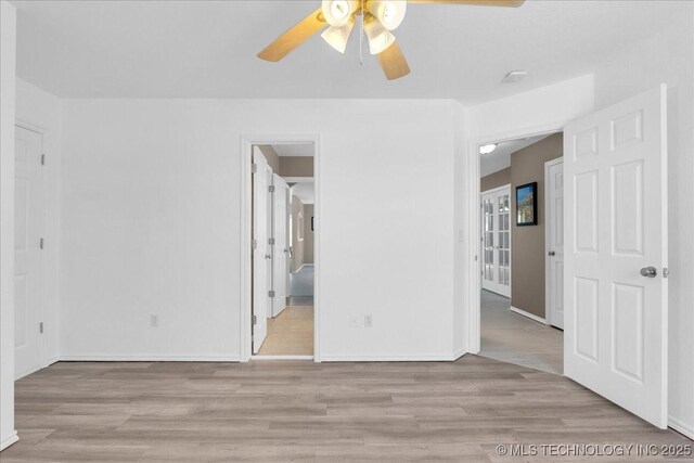 3000 S Tamarack Ave, Broken Arrow, OK 74012 - empty room with a ceiling fan, wood finished floors, and baseboards