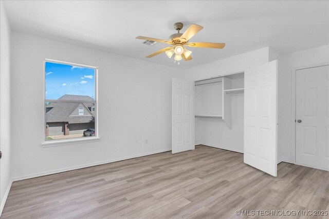 3000 S Tamarack Ave, Broken Arrow, OK 74012 - unfurnished bedroom with wood finished floors, a closet, baseboards, and ceiling fan