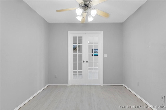 3000 S Tamarack Ave, Broken Arrow, OK 74012 - unfurnished room featuring french doors, wood finished floors, a ceiling fan, and baseboards