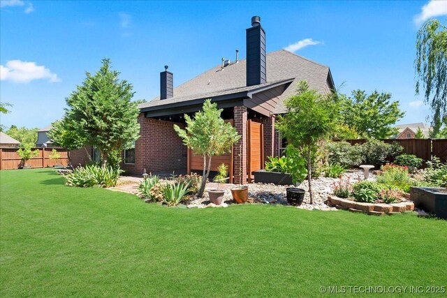 3000 S Tamarack Ave, Broken Arrow, OK 74012 - rear view of property with a chimney and brick siding
