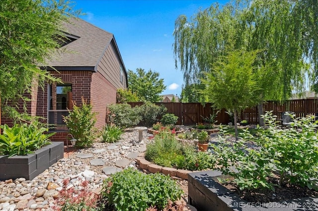 3000 S Tamarack Ave, Broken Arrow, OK 74012 - fenced backyard featuring a vegetable garden