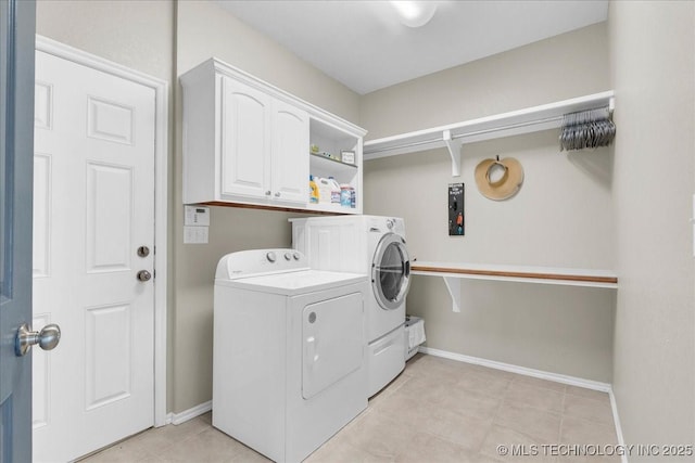 3000 S Tamarack Ave, Broken Arrow, OK 74012 - washroom featuring independent washer and dryer, cabinet space, baseboards, and light tile patterned floors