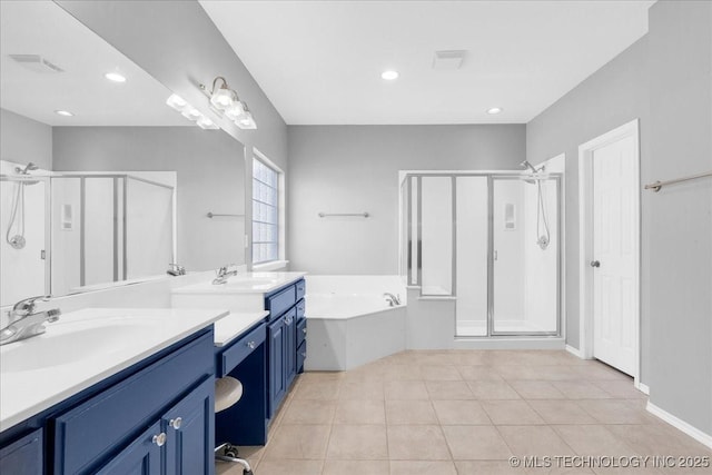 3000 S Tamarack Ave, Broken Arrow, OK 74012 - bathroom featuring a stall shower, two vanities, a bath, tile patterned flooring, and recessed lighting