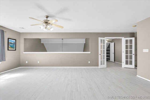 3000 S Tamarack Ave, Broken Arrow, OK 74012 - empty room featuring french doors, baseboards, ceiling fan, and wood finished floors