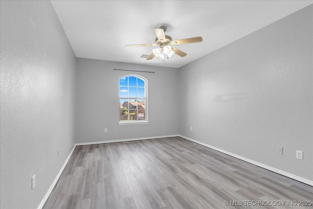 3000 S Tamarack Ave, Broken Arrow, OK 74012 - unfurnished room with a ceiling fan, wood finished floors, and baseboards