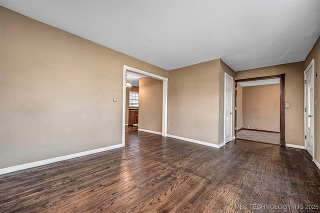 506 W 17th, Sulphur, OK 73086 - spare room with dark wood-type flooring and baseboards
