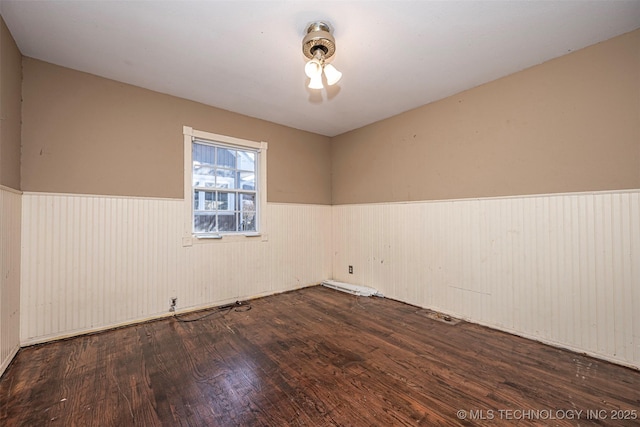 506 W 17th, Sulphur, OK 73086 - unfurnished room featuring wainscoting and wood finished floors