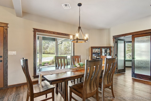4748 N 4318th Rd, Pryor, OK 74361 - dining space featuring a chandelier, wood finished floors, french doors, and baseboards