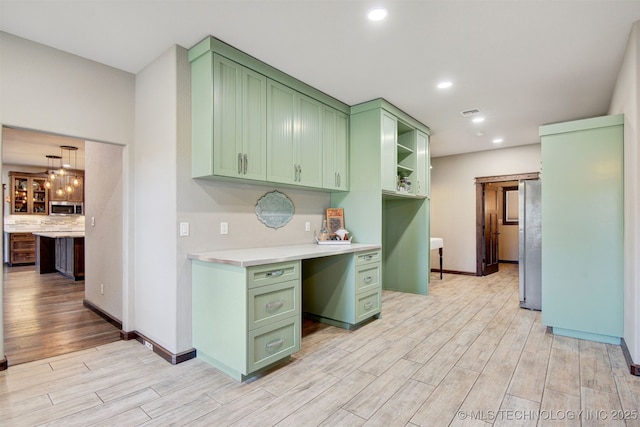 4748 N 4318th Rd, Pryor, OK 74361 - kitchen featuring green cabinetry, light wood finished floors, light countertops, stainless steel appliances, and recessed lighting