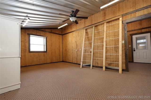 4748 N 4318th Rd, Pryor, OK 74361 - carpeted empty room featuring wood walls and ceiling fan
