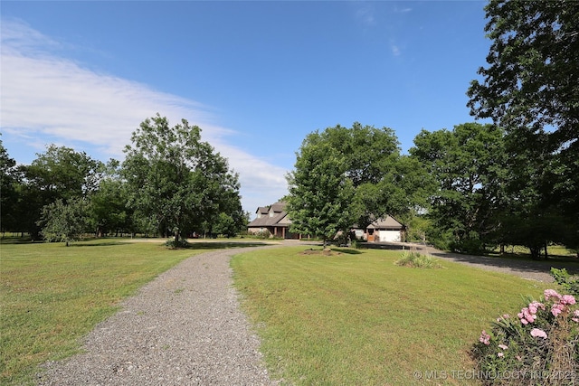 4748 N 4318th Rd, Pryor, OK 74361 - view of front of house with driveway, a front lawn, and a garage