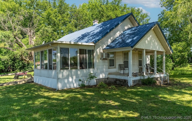 33321 S 4470th Rd, Vinita, OK 74301 - view of front facade featuring a porch, a front lawn, a sunroom, a chimney, and cooling unit