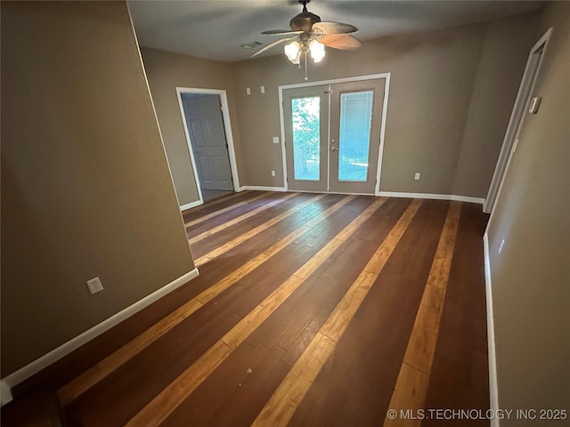 905 Brookside Dr, Durant, OK 74701 - spare room with a ceiling fan, baseboards, hardwood / wood-style floors, and french doors