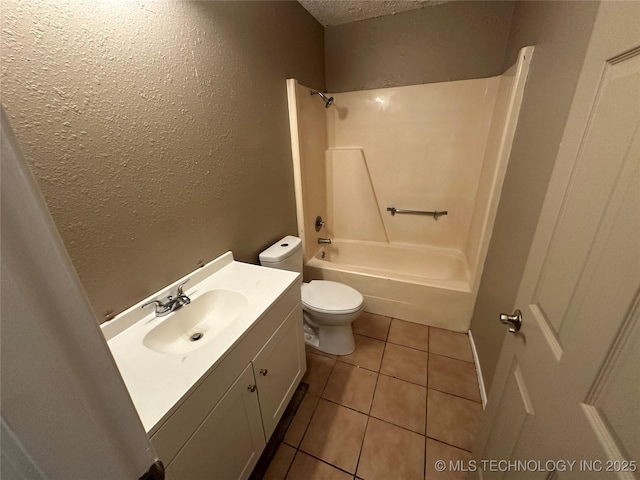 905 Brookside Dr, Durant, OK 74701 - full bath featuring toilet, vanity, a textured ceiling, a textured wall, and tile patterned flooring